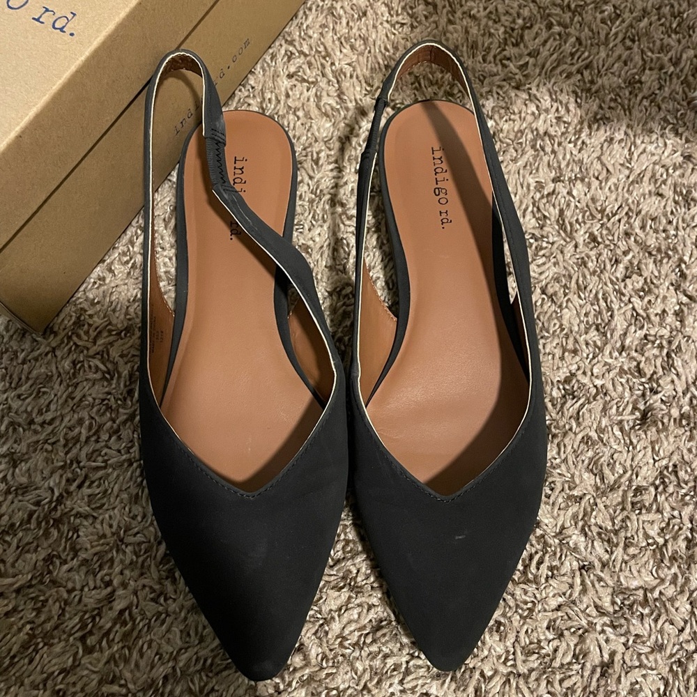 Black sling flats.